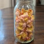 A half-gallon mason jar full of freeze-dried birthday cake bites.