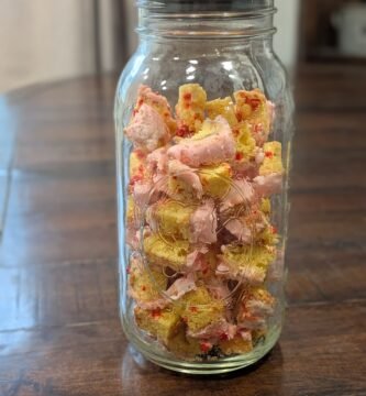 A half-gallon mason jar full of freeze-dried birthday cake bites.