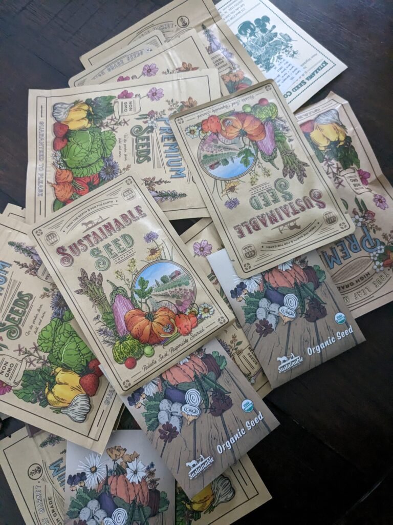 Pile of different vegetable and flower seeds. Organic and sustainable seeds for the garden