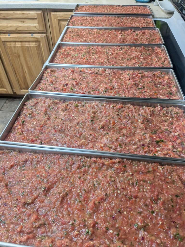 Trays of homemade salsa being prepped for the freeze-dryer