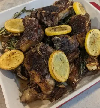 Pan seared paleo friendly lamb chop dinner recipe with garlic, rosemary, and lemon