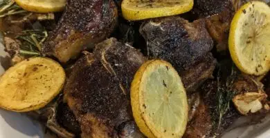 Pan seared paleo friendly lamb chop dinner recipe with garlic, rosemary, and lemon