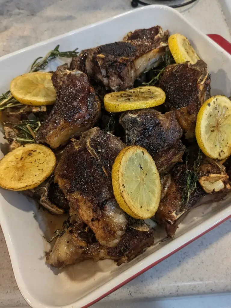 Pan seared paleo friendly lamb chop dinner recipe with garlic, rosemary, and lemon