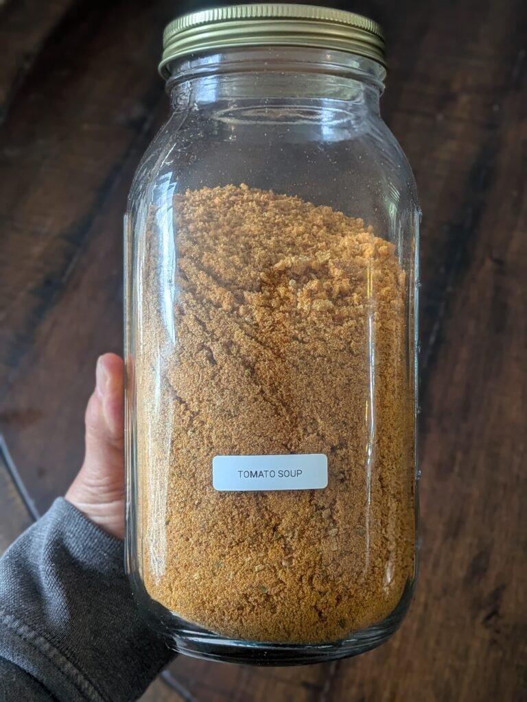 A half-gallon mason jar full of freeze-dried tomato soup