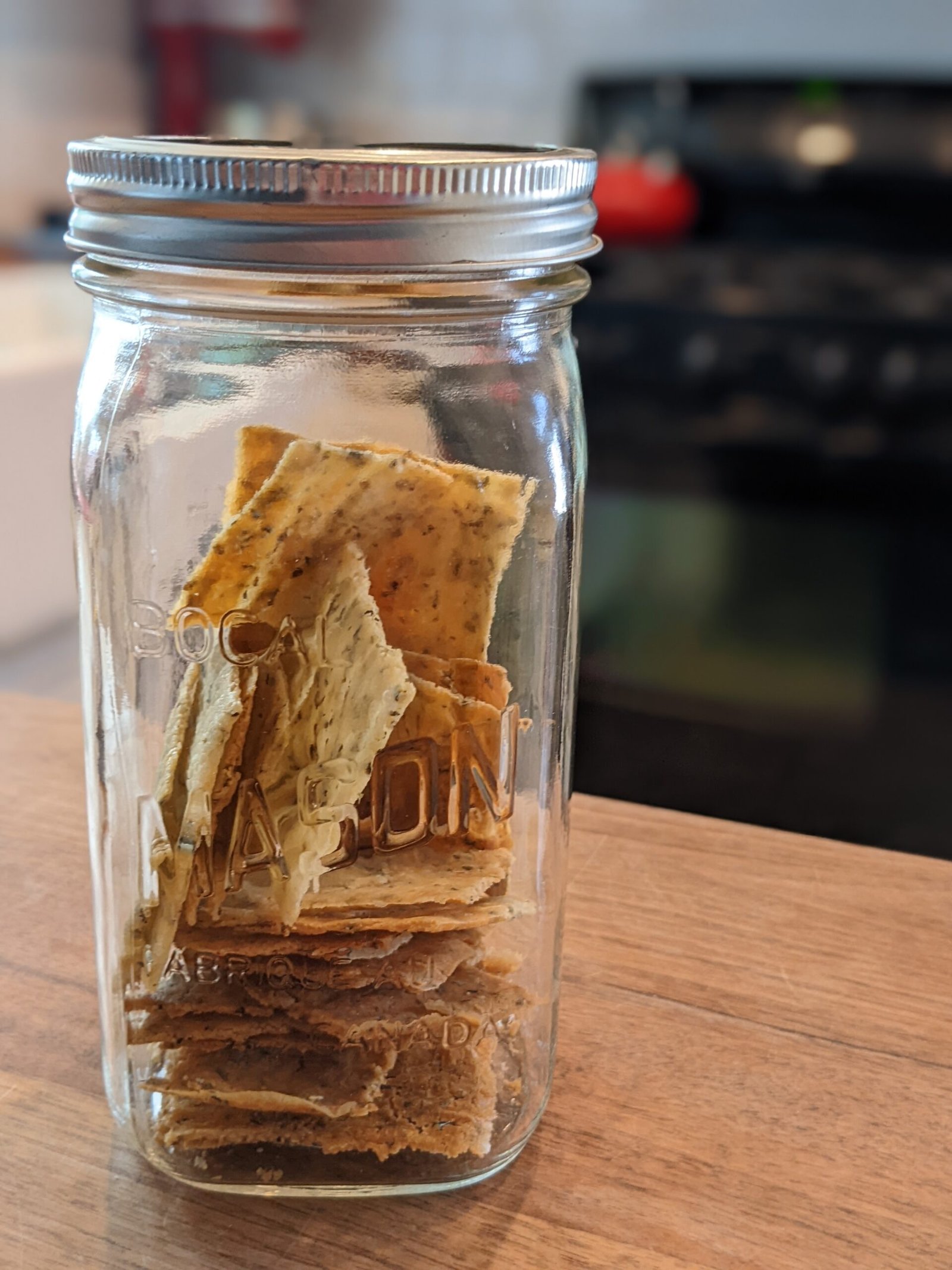 Sourdough discard crackers stored in an airtight mason jar