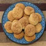 A plate of freshly baked sourdough discard snickerdoodle cookies