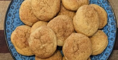 A plate of freshly baked sourdough discard snickerdoodle cookies