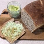 garlic scape butter with a fresh loaf of sourdough bread