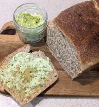garlic scape butter with a fresh loaf of sourdough bread