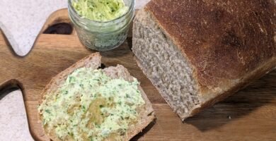 garlic scape butter with a fresh loaf of sourdough bread