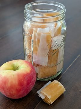 mason jar full of homemade applesauce fruit leathers
